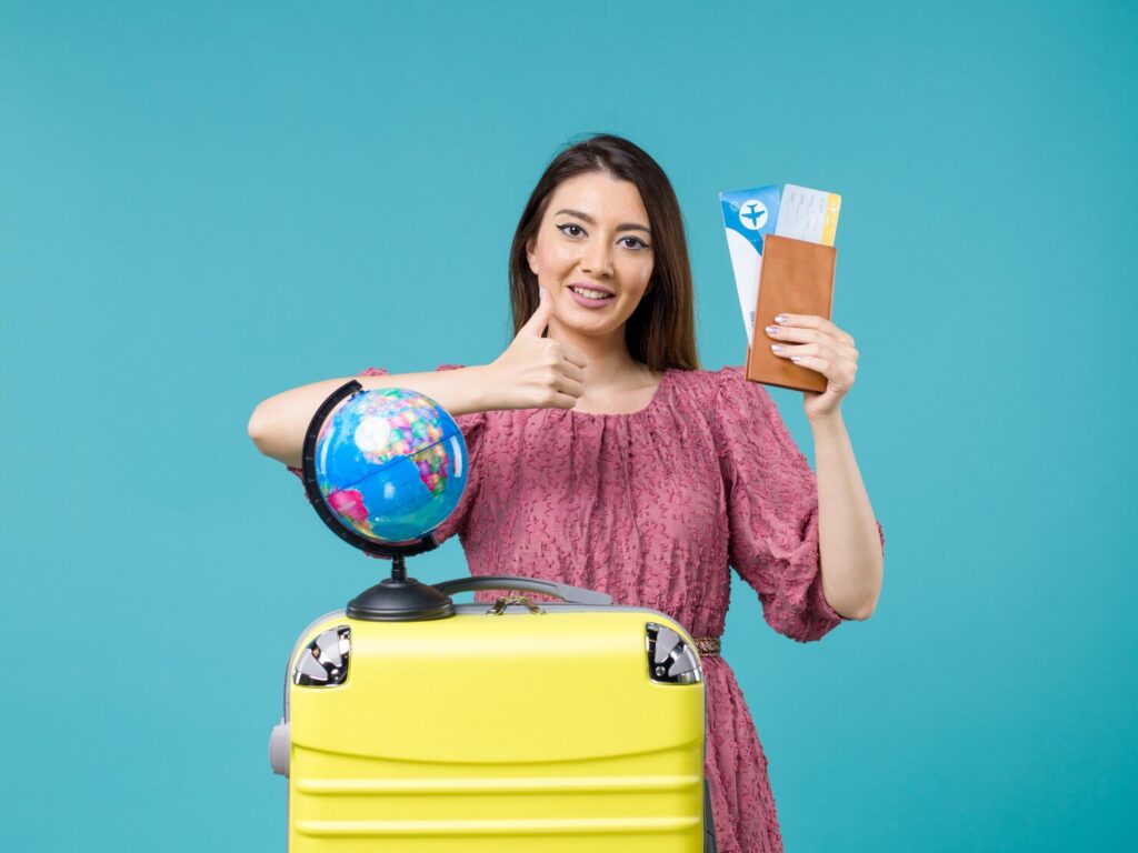"Traveler with yellow suitcase, globe, passport, and boarding pass ready for international journey"